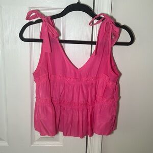 I’m selling this hot pink ruffle tank top with cute tie bows on the sides!